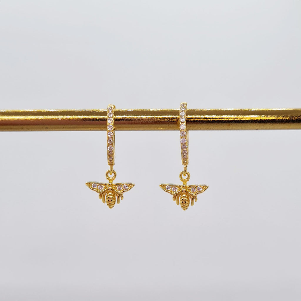 Gold queen bee huggie earrings with cubic zirconia gems