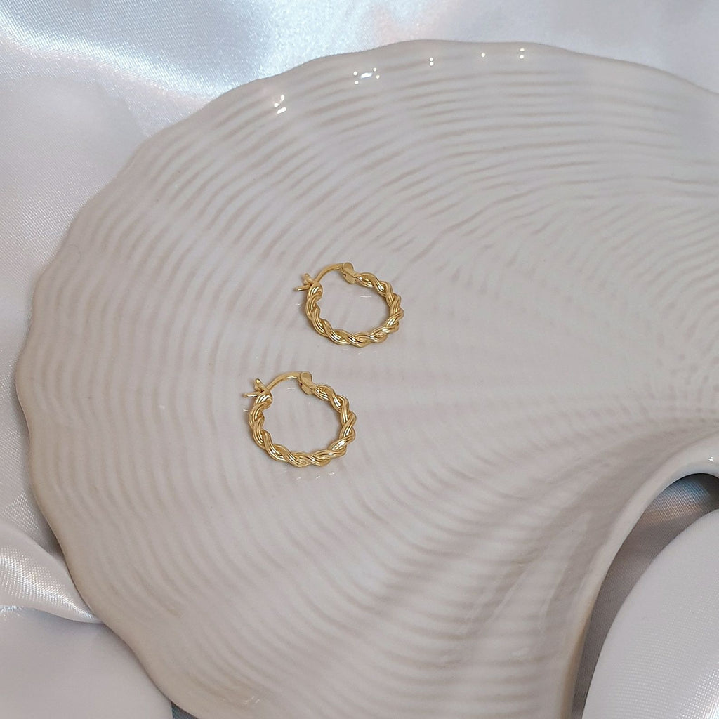 Gold Callie Rope Hoop Earrings on shell trinket dish
