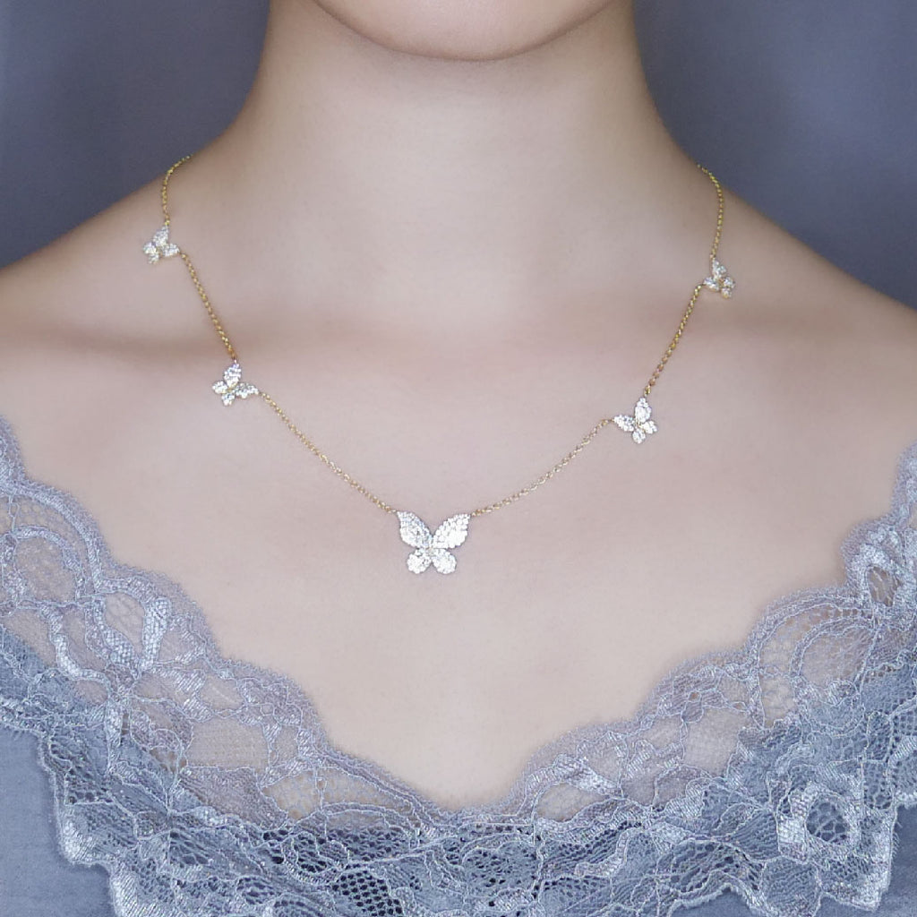 Model wearing Daphne butterfly necklace