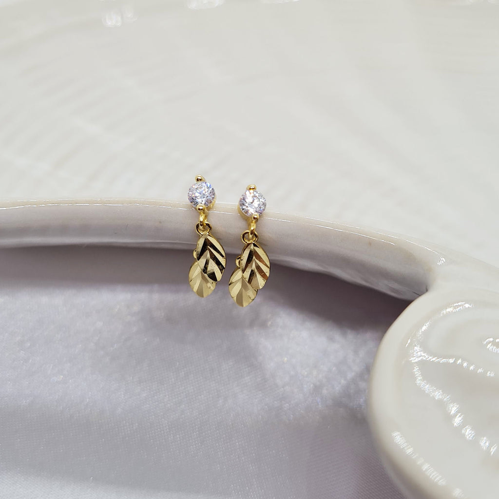 Gold leaf drop earrings on shell shaped plate