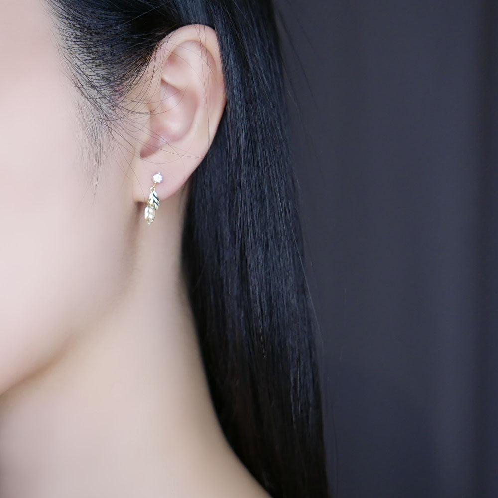 Model wearing Gold Leaf Drop Earrings
