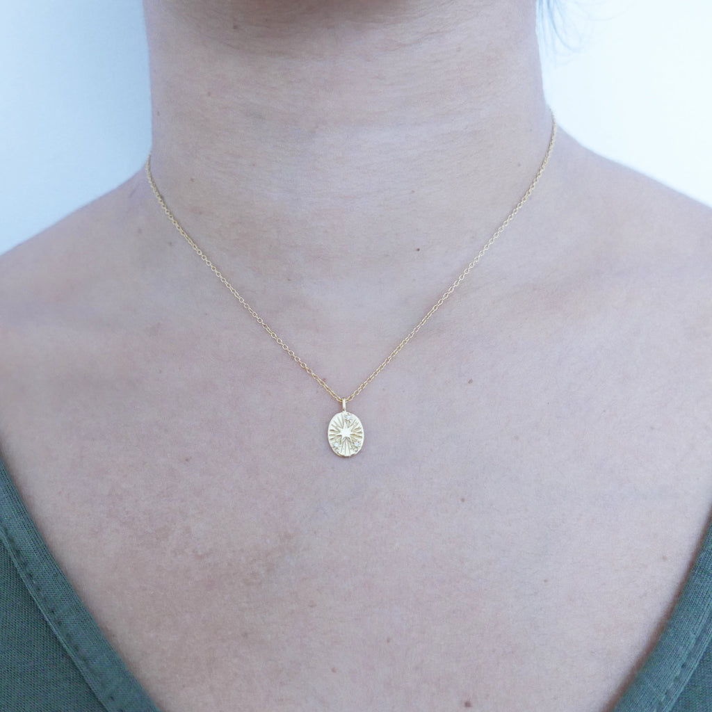 Gold Star Disc Pendant necklace on model