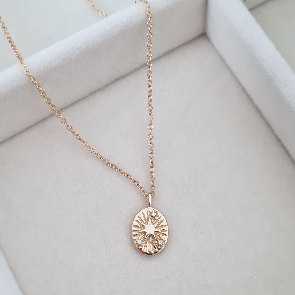 Gold star disc necklace