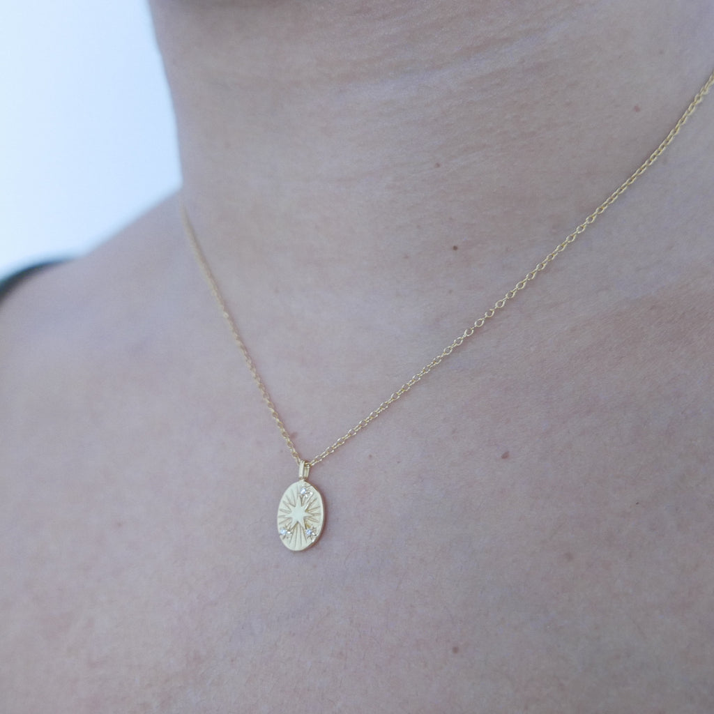 Gold Star Disc Pendant necklace on model