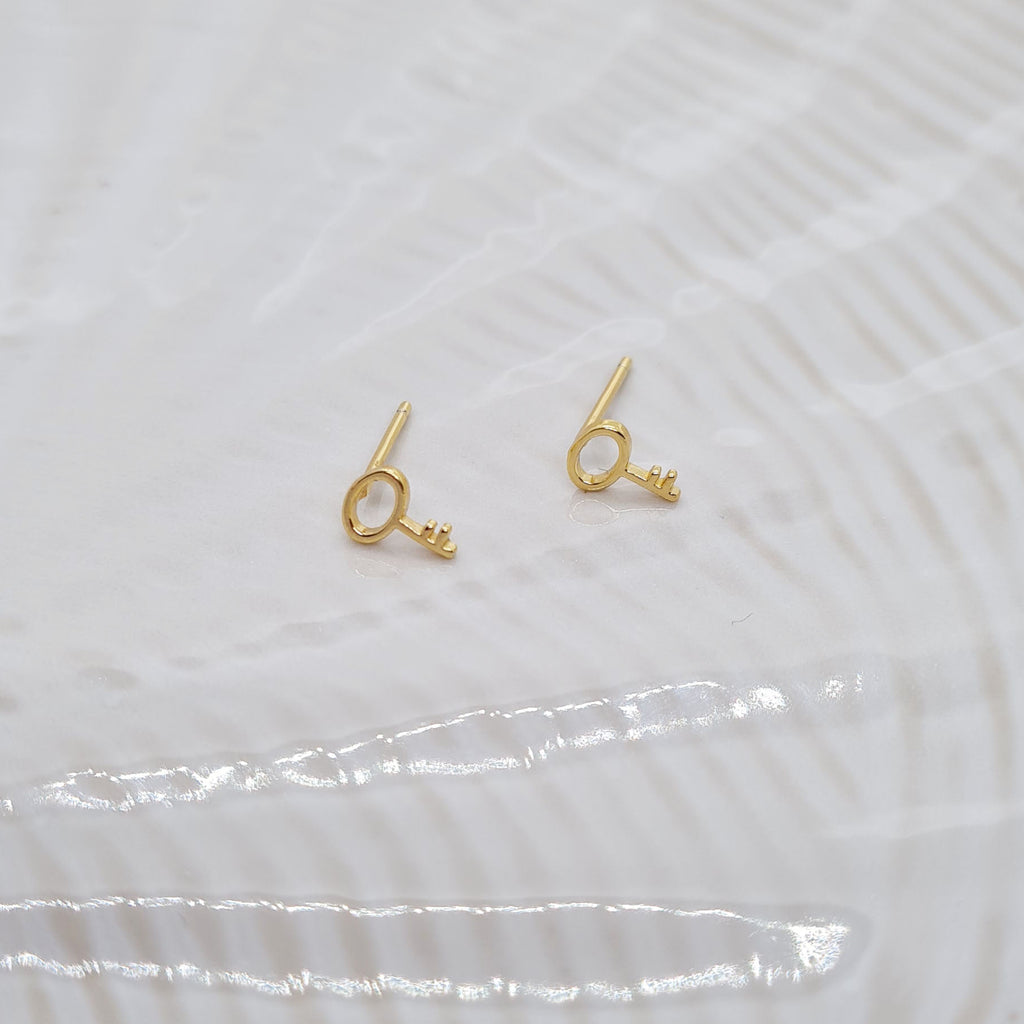 Gold key stud earrings