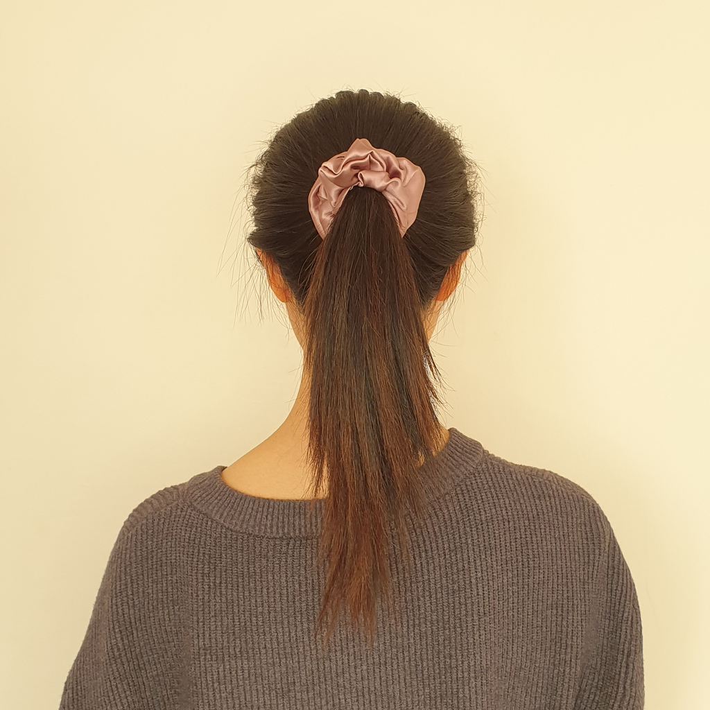 Mauve pink silk hair scrunchie in model's hair