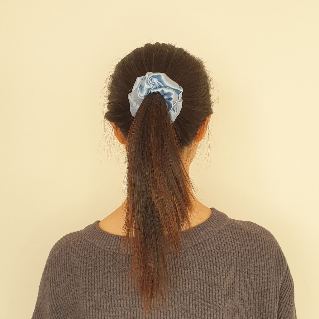 Pastel blue big hair scrunchie in model's hair