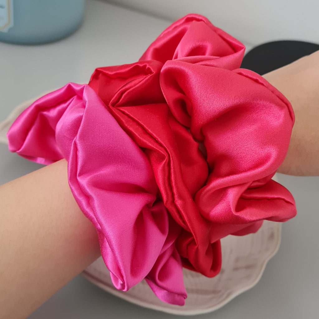 Red Hot Pink Luxe Silk Scrunchies on arm