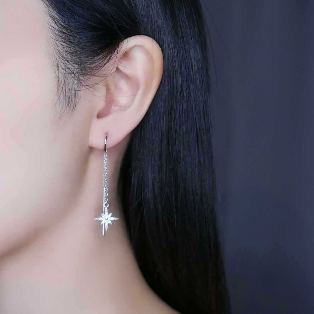 Model wearing silver shining star threader earring